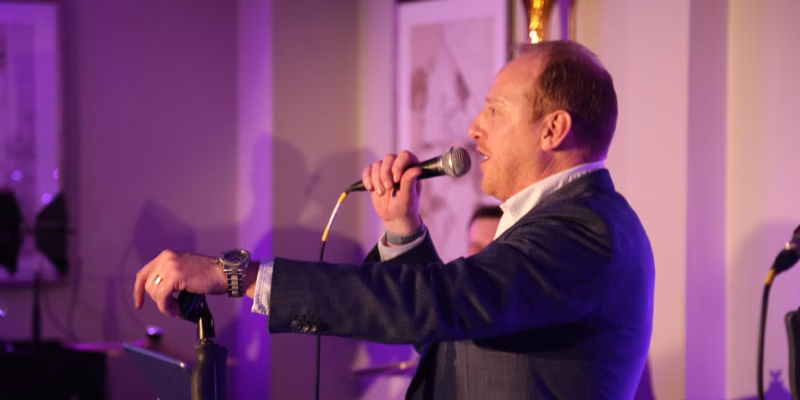 Sparq member of the team speaking into a microphone